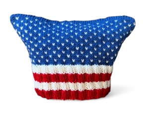 Handmade patriotic hat featuring red, white, and blue colors, adorned with stars and stripes, symbolizing support for the Women's March and unity in the community